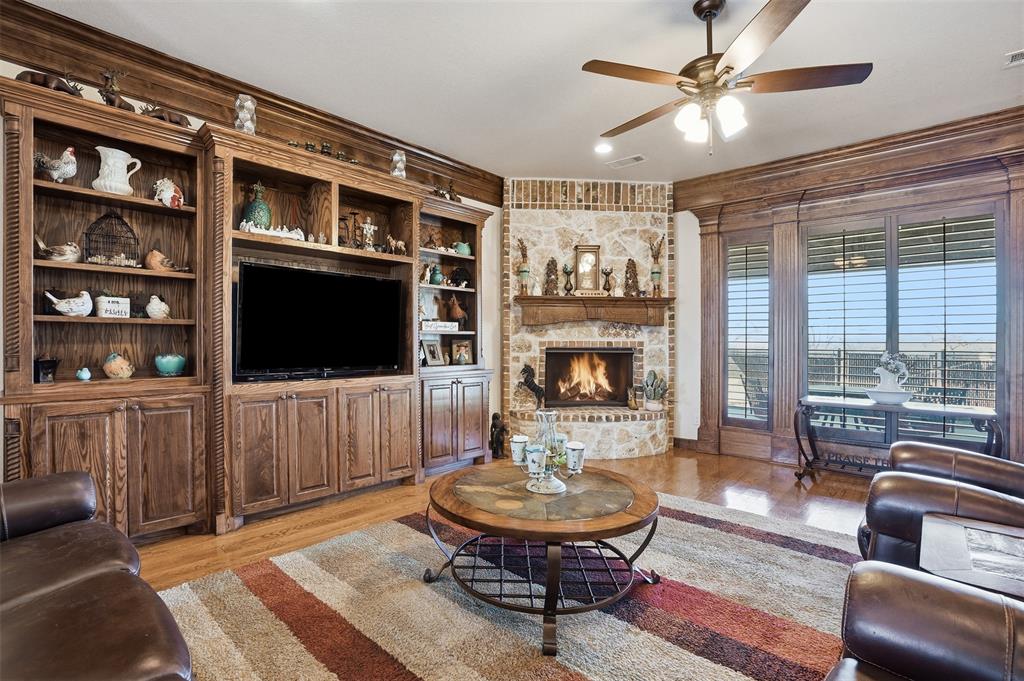 842 County Road 4371 Decatur, TX 76234 - Photo 18 of 35 a living room with furniture a flat screen tv and a fireplace
