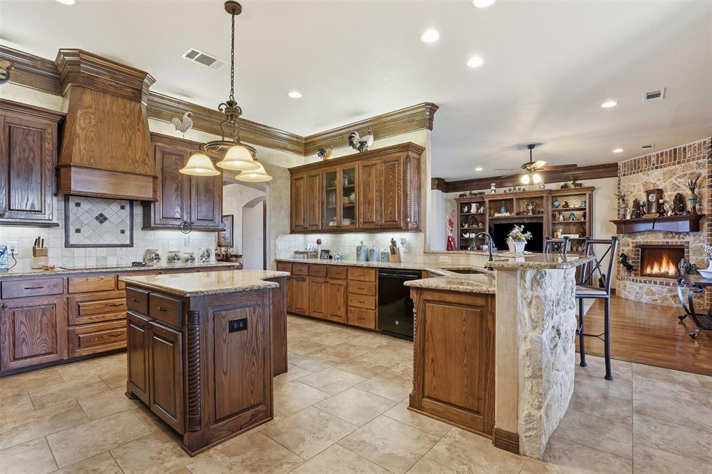 842 County Road 4371 Decatur, TX 76234 - Photo 20 of 35 a kitchen with stainless steel appliances granite countertop a stove oven and a refrigerator