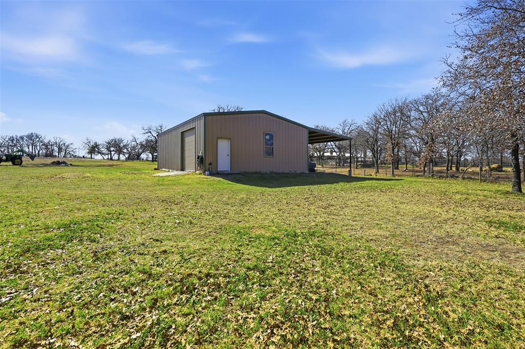842 County Road 4371 Decatur, TX 76234 - Photo 30 of 35 a big house with a big yard and large trees