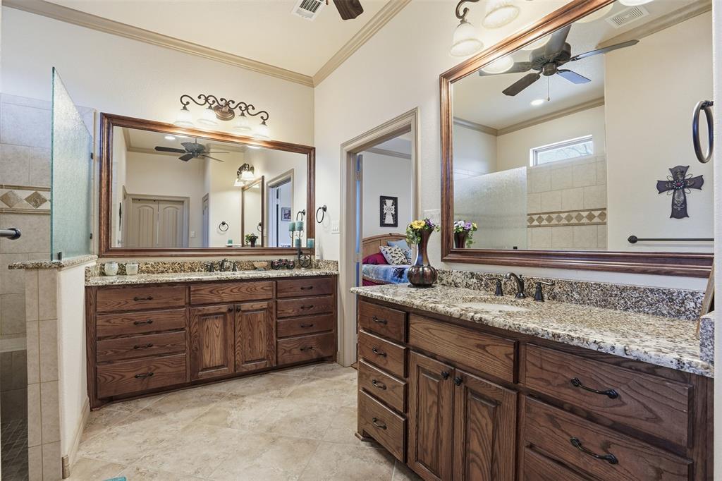 842 County Road 4371 Decatur, TX 76234 - Photo 6 of 35 a bathroom with a granite countertop double vanity sink and a mirror