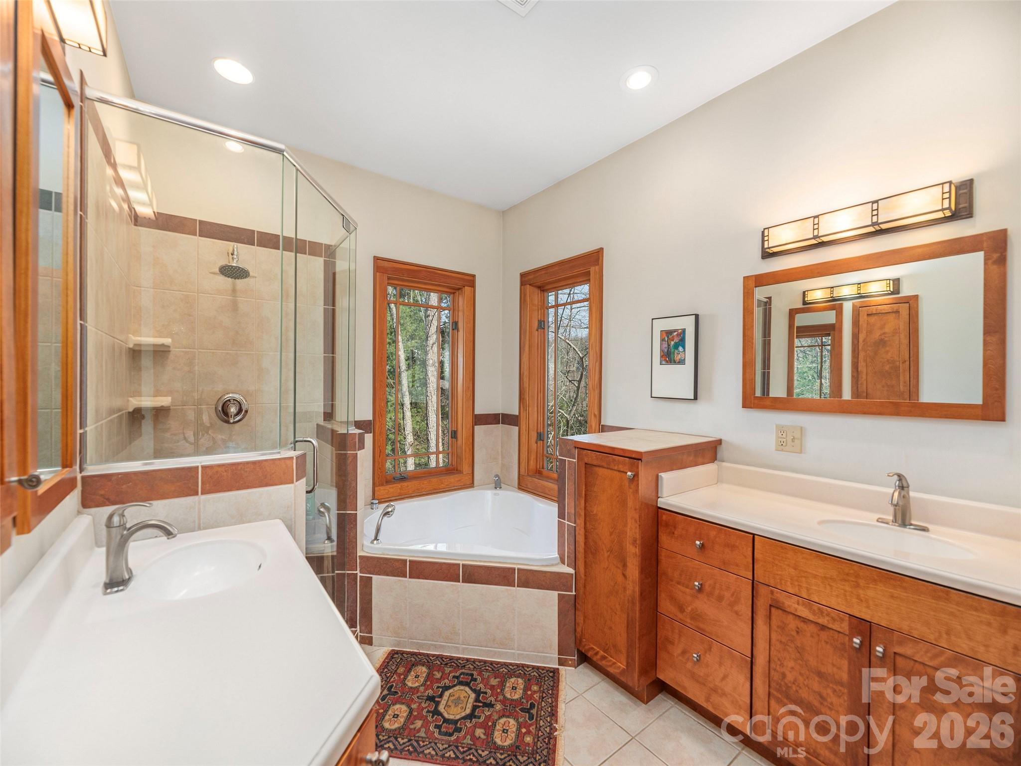 68 Crestwood Road Asheville, NC 28804 - Photo 20 of 37 a spacious bathroom with sink shower and mirror