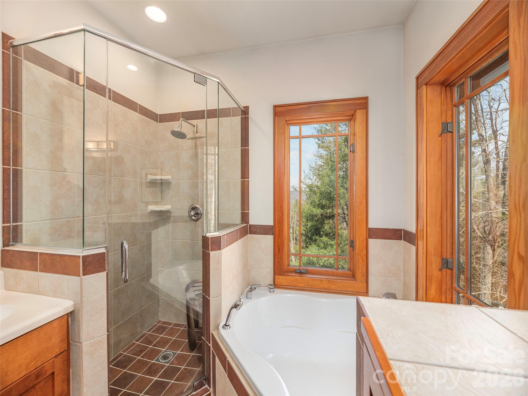 68 Crestwood Road Asheville, NC 28804 - Photo 21 of 37 a spacious bathroom with a tub shower and sink