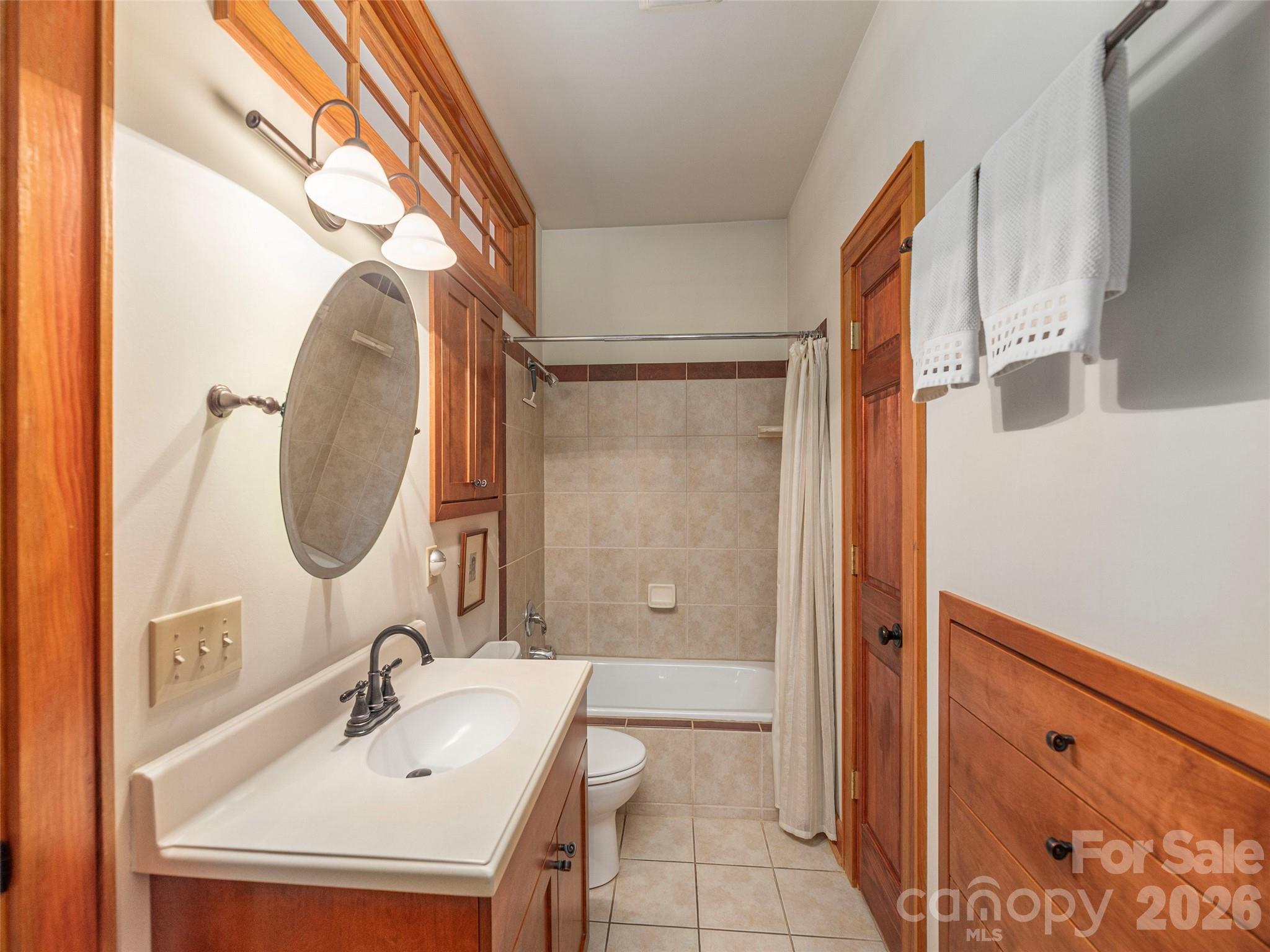 68 Crestwood Road Asheville, NC 28804 - Photo 24 of 37 a bathroom with a sink and a mirror