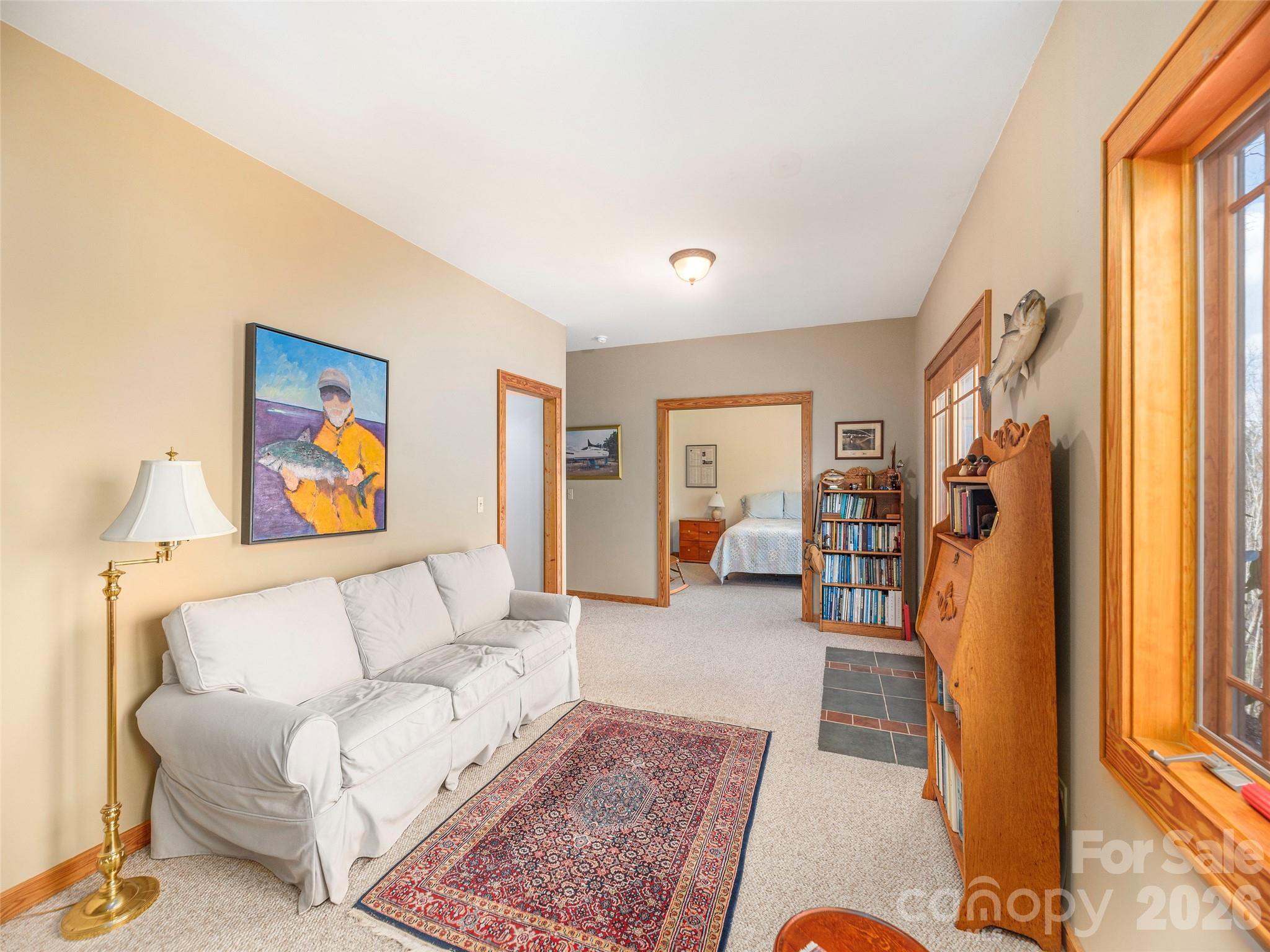 68 Crestwood Road Asheville, NC 28804 - Photo 26 of 37 a living room with furniture and a flat screen tv