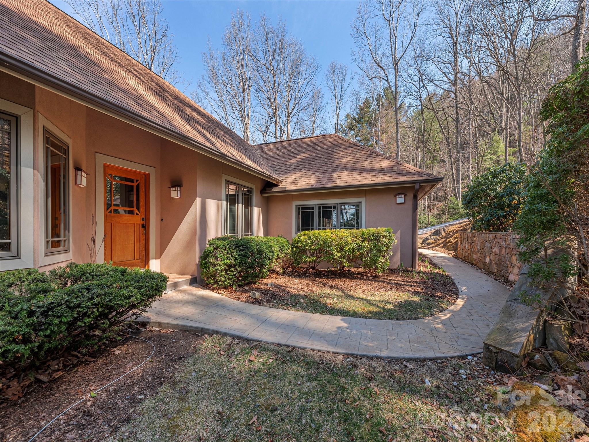 68 Crestwood Road Asheville, NC 28804 - Photo 3 of 37 a front view of a house with garden