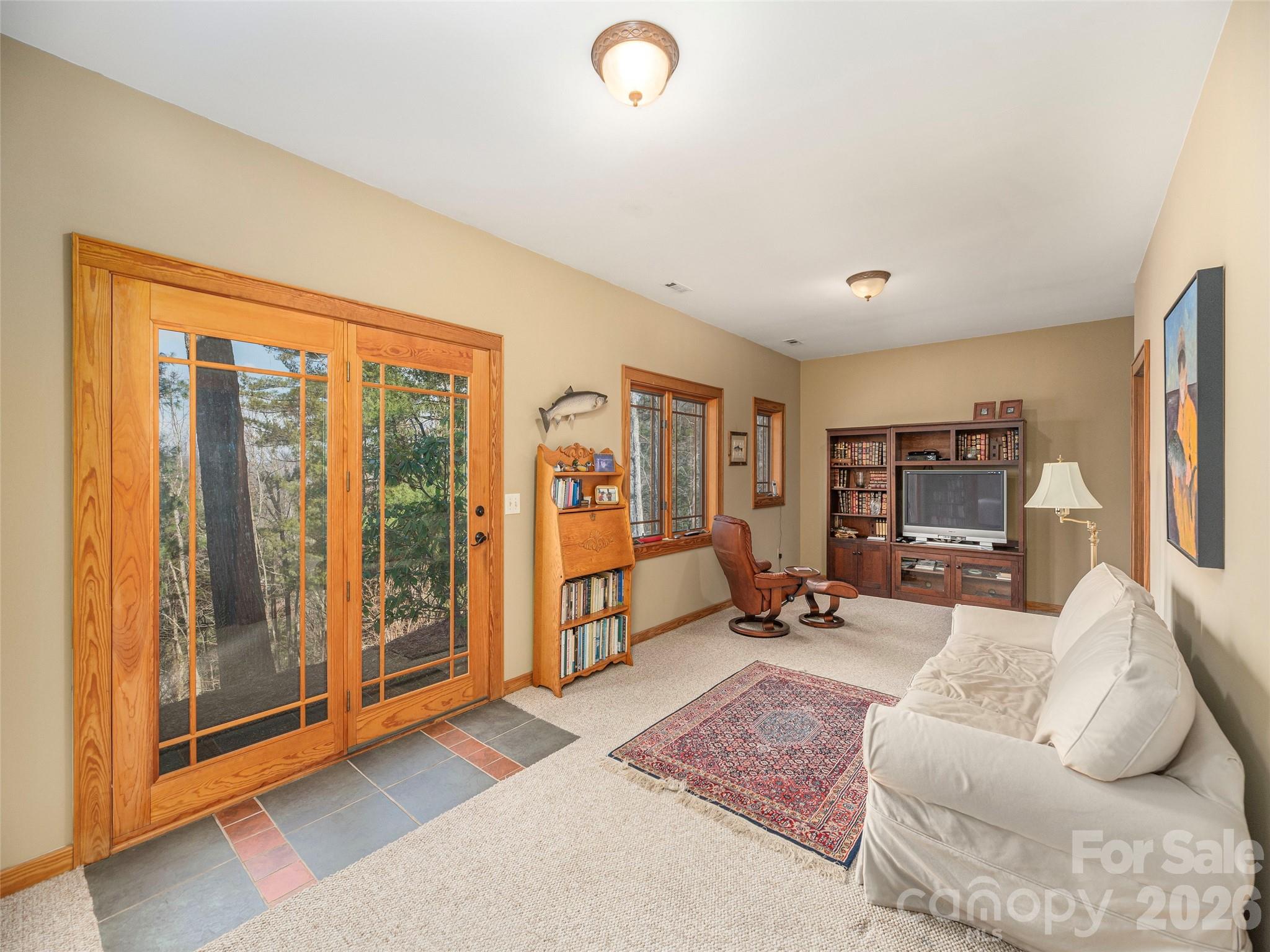 68 Crestwood Road Asheville, NC 28804 - Photo 31 of 37 a living room with furniture and a flat screen tv
