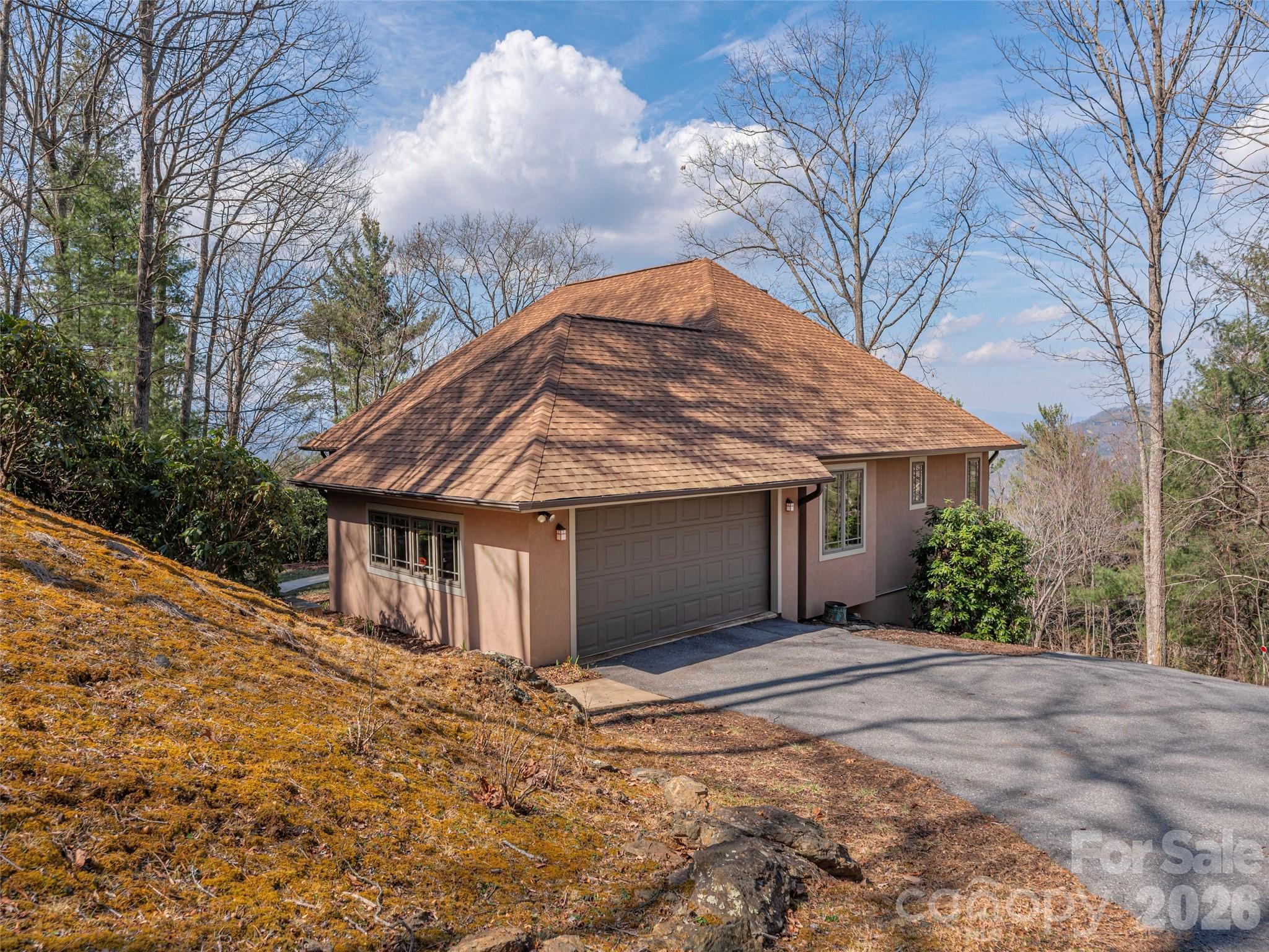 68 Crestwood Road Asheville, NC 28804 - Photo 33 of 37 a front view of a house with a yard and garage