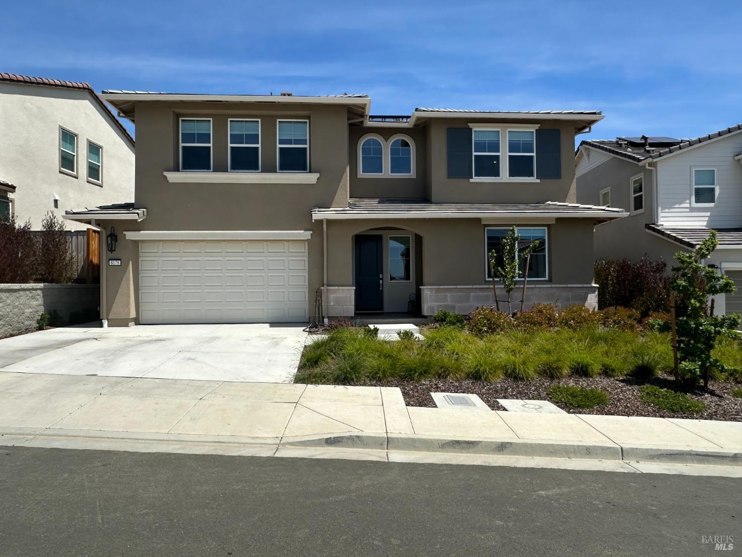 8178 Rainwater Drive Vallejo, CA 94591 - Photo 1 of 1 a front view of a house with a yard and garage