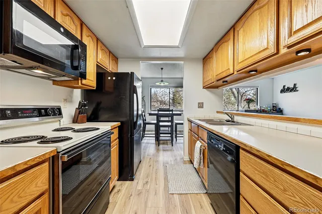 a kitchen with stainless steel appliances granite countertop a stove and a sink