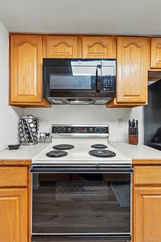 a kitchen with a stove and a microwave
