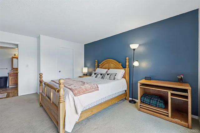 a bedroom with a bed and a fireplace