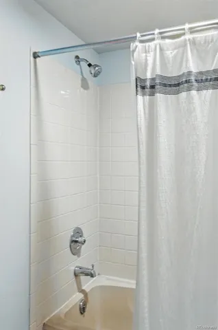 a bathroom that has a glass shower door