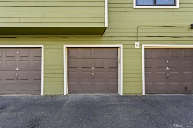 a front view of a house with a garage