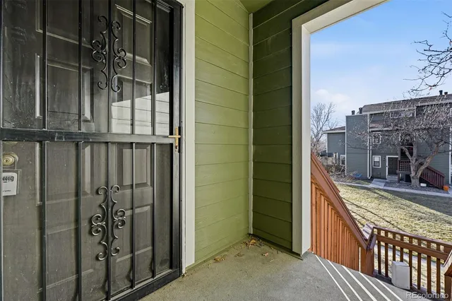 a view of a balcony with door