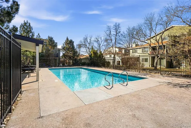 a view of swimming pool with a yard
