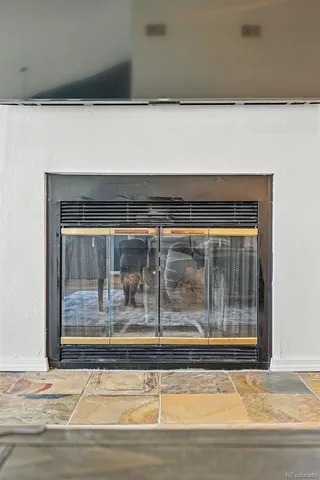 a view of a living room that has a fireplace