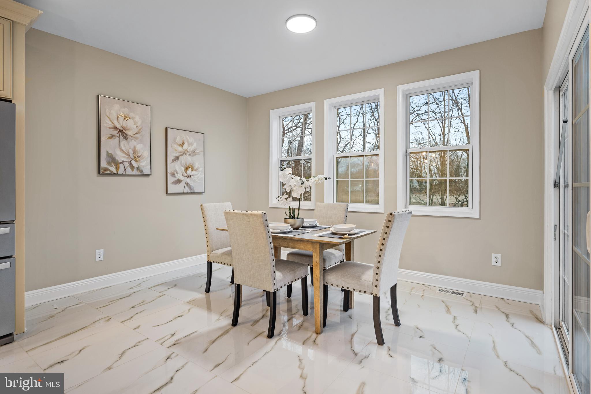 6 River Run Lawnside, NJ 08045 - Photo 14 of 64 a dining room with wooden floor and a window