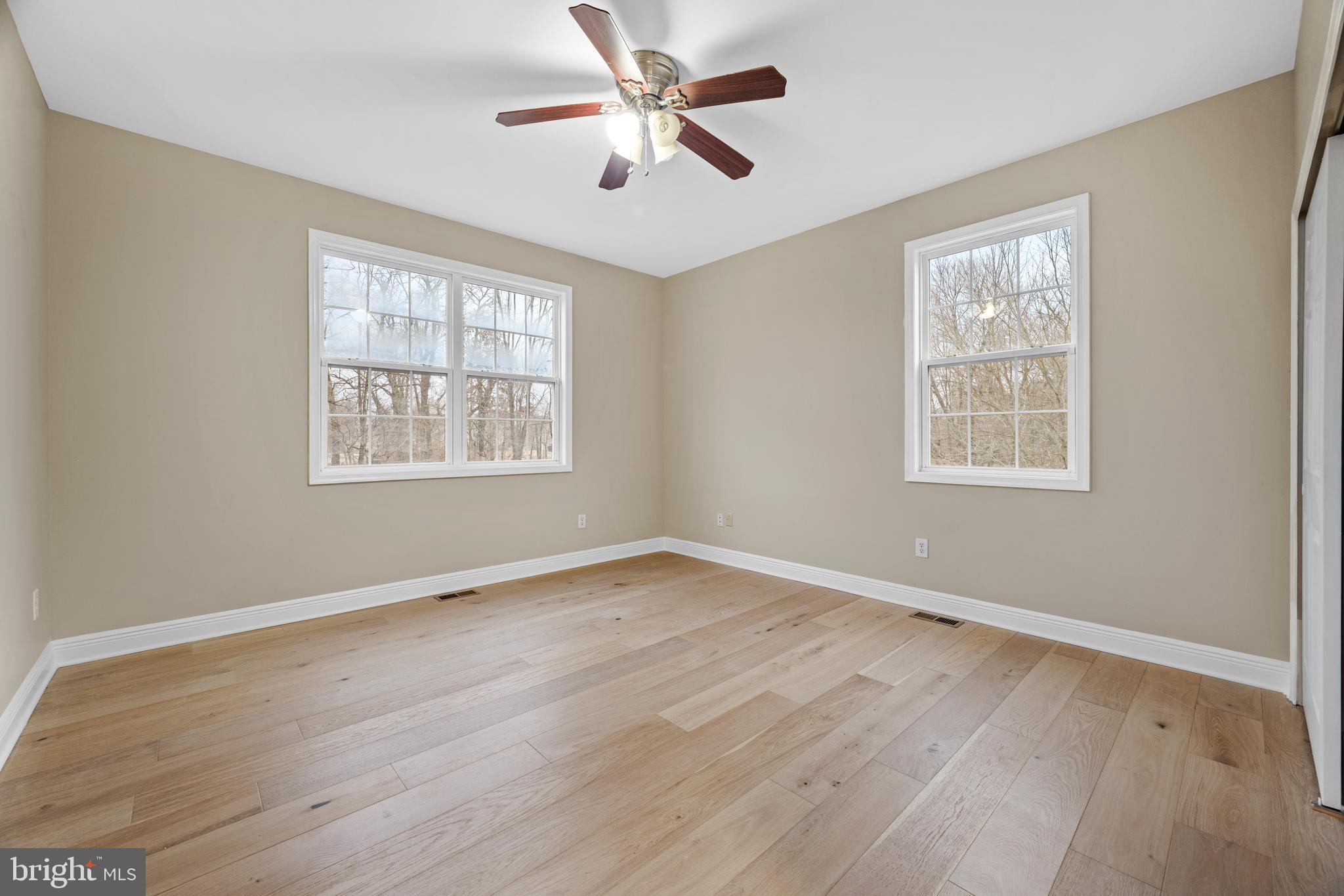 6 River Run Lawnside, NJ 08045 - Photo 18 of 64 a view of an empty room with window and wooden floor