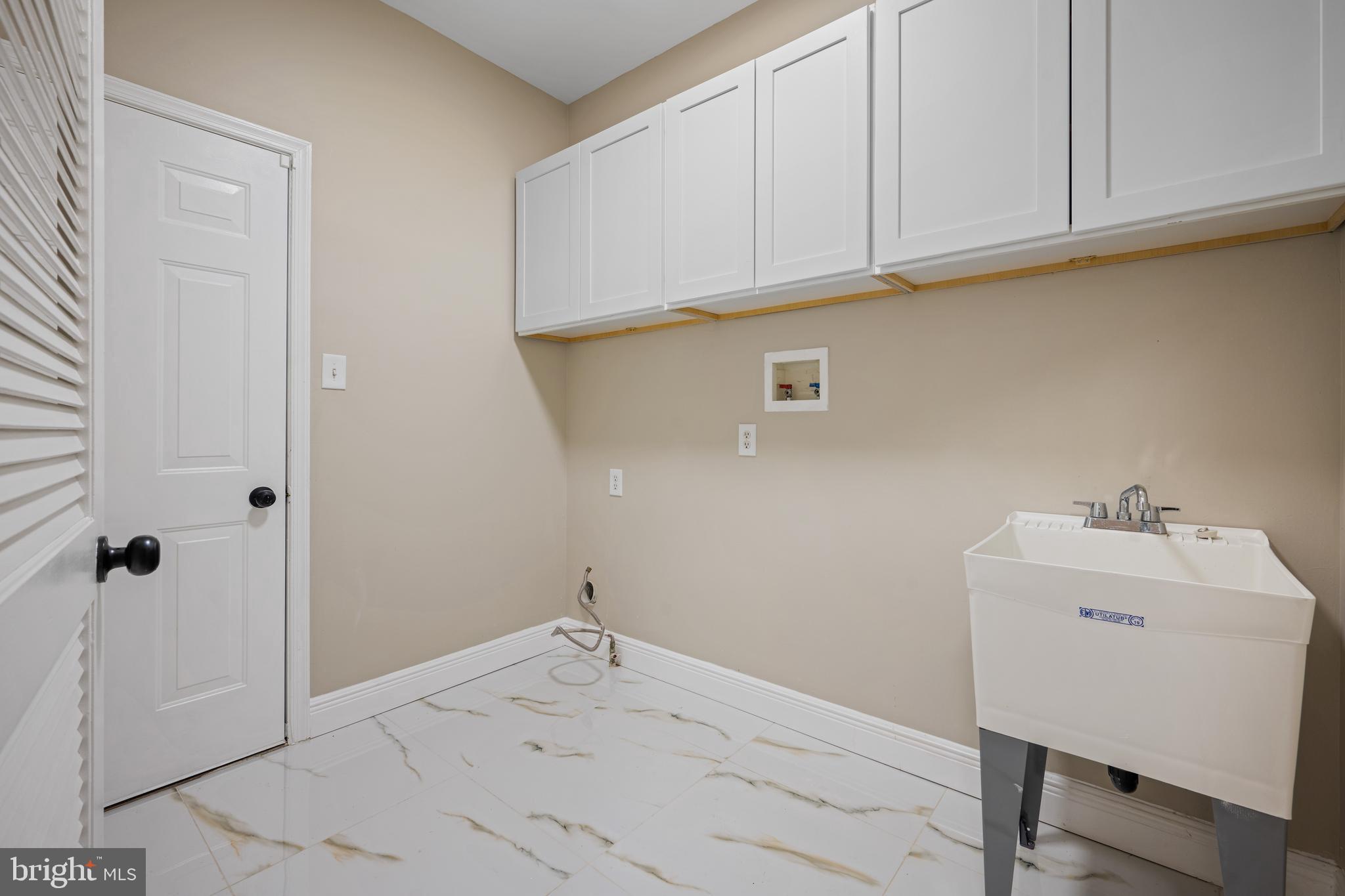 6 River Run Lawnside, NJ 08045 - Photo 27 of 64 a bathroom with a sink and cabinets