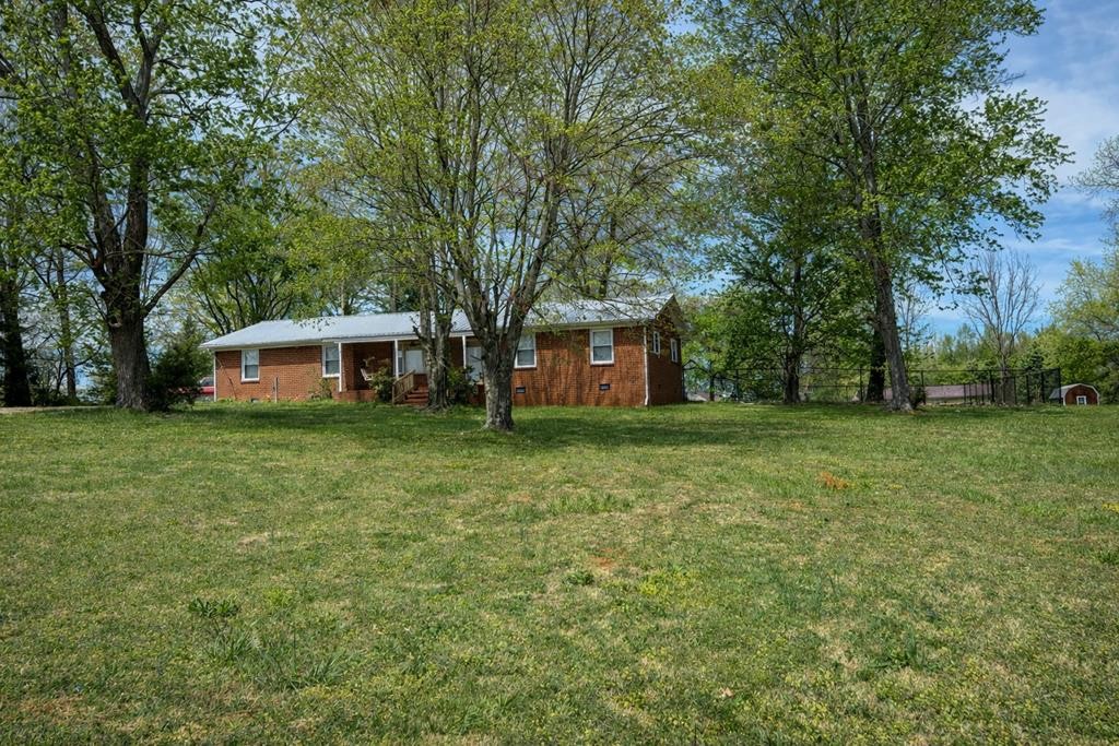 2633 Spencer Road Rock Island, TN 38581 - Photo 2 of 37 a front view of a house with a garden