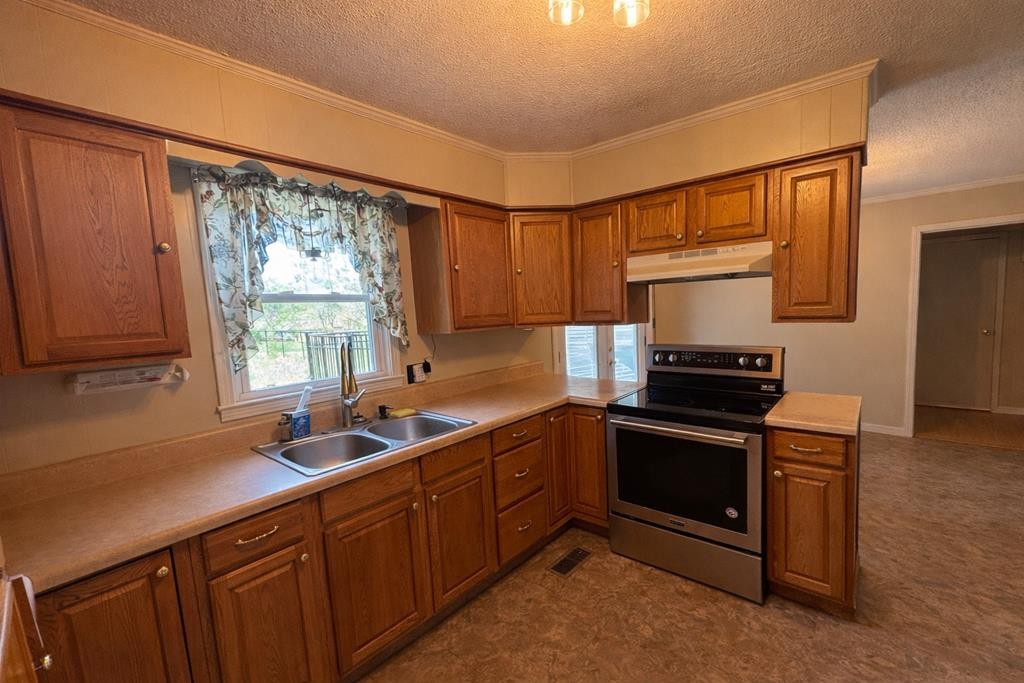 2633 Spencer Road Rock Island, TN 38581 - Photo 8 of 37 a kitchen with stainless steel appliances a sink cabinets and a window