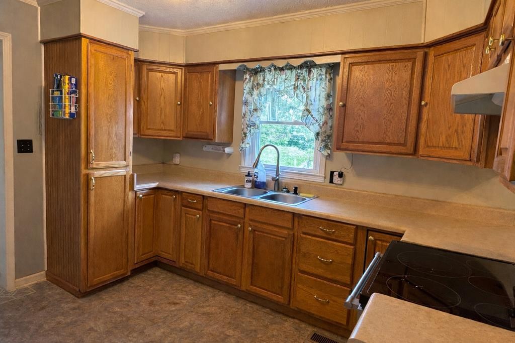 2633 Spencer Road Rock Island, TN 38581 - Photo 9 of 37 a kitchen with stainless steel appliances a sink stove and refrigerator