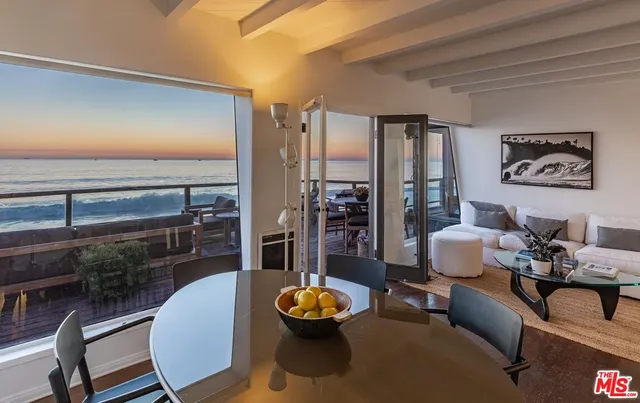 a living room with furniture and a lamp