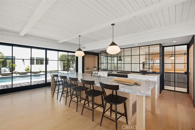 a view of a entryway door with lamp and chandelier