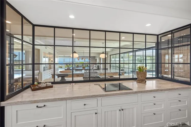a very nice looking room with a large window and sink