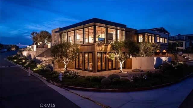 a view of swimming pool with outdoor seating and house in the background