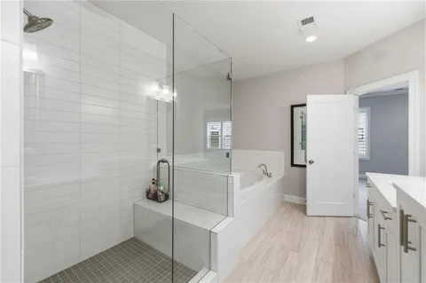 a bathroom with a double vanity sink mirror and double
