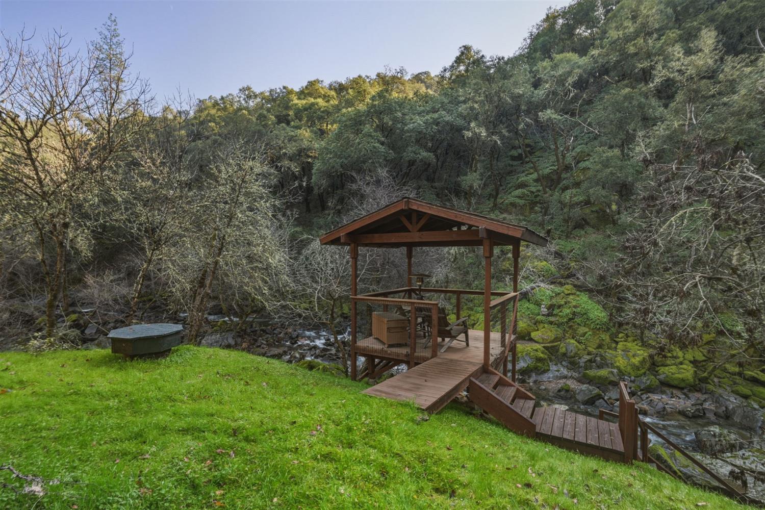 11 Upton Road Mount Aukum, CA 95656 - Photo 19 of 30 a view of a wooden deck with a bench in a park