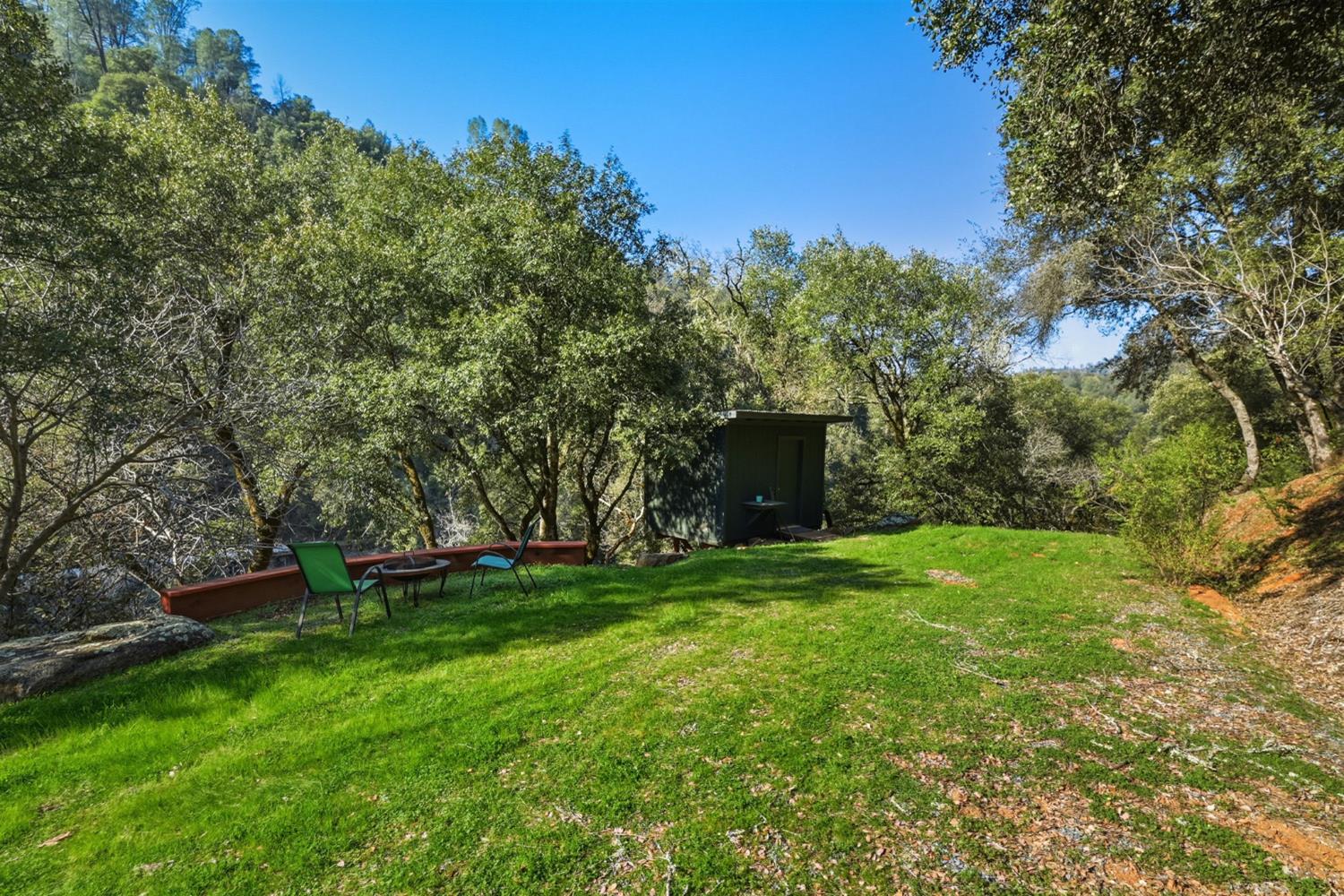 11 Upton Road Mount Aukum, CA 95656 - Photo 8 of 30 a view of a backyard with a garden and entertaining space