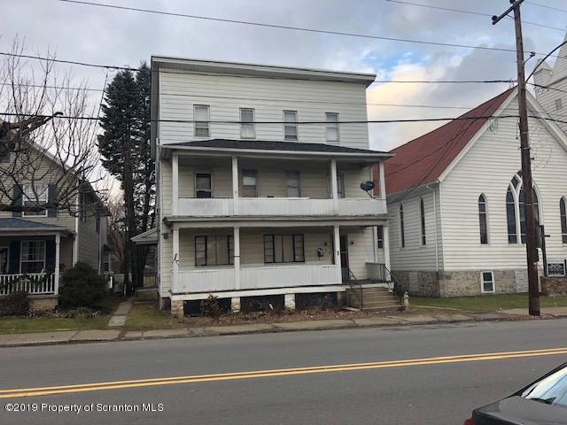 408 Main Street Moosic, PA 18507 - Photo 1 of 6 a front view of a house with a garage