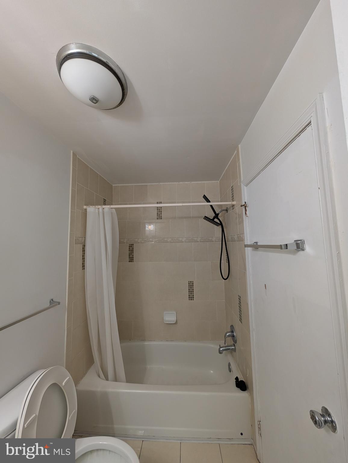 312 Cold Spring Place Dover, DE 19904 - Photo 18 of 31 a bathroom with a shower and a toilet