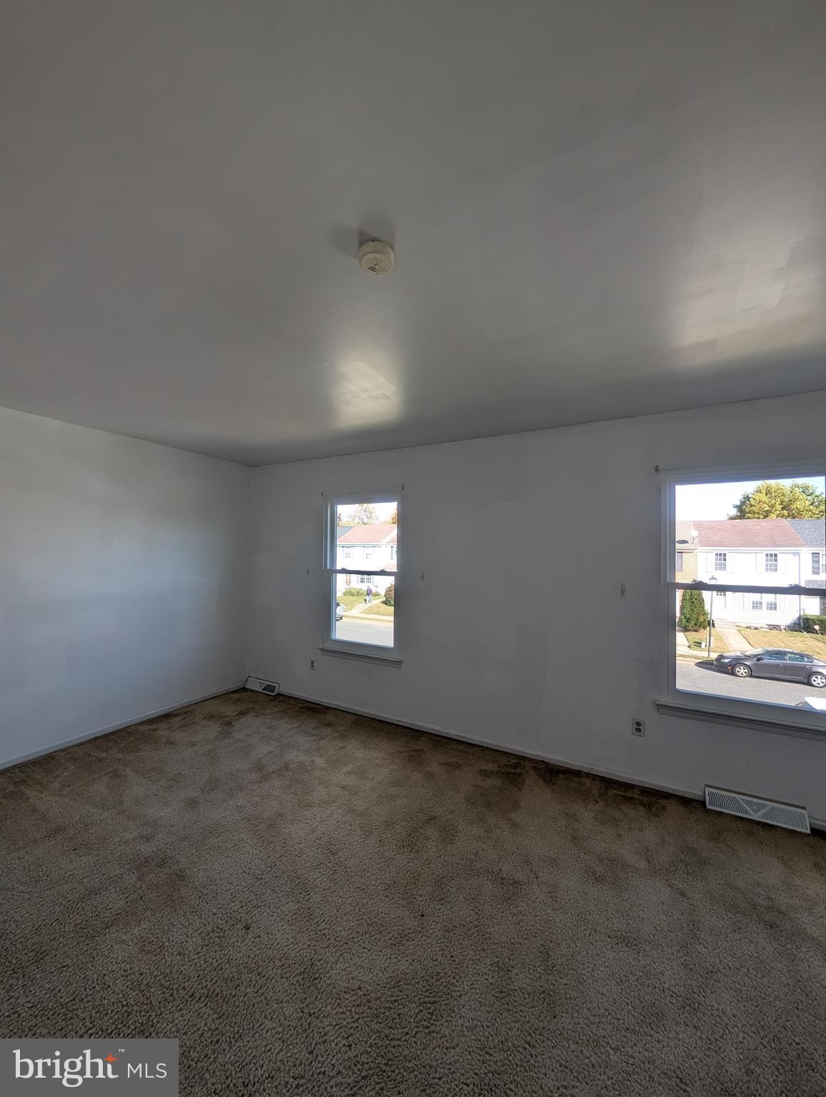 312 Cold Spring Place Dover, DE 19904 - Photo 23 of 31 an empty room with a window and a fireplace