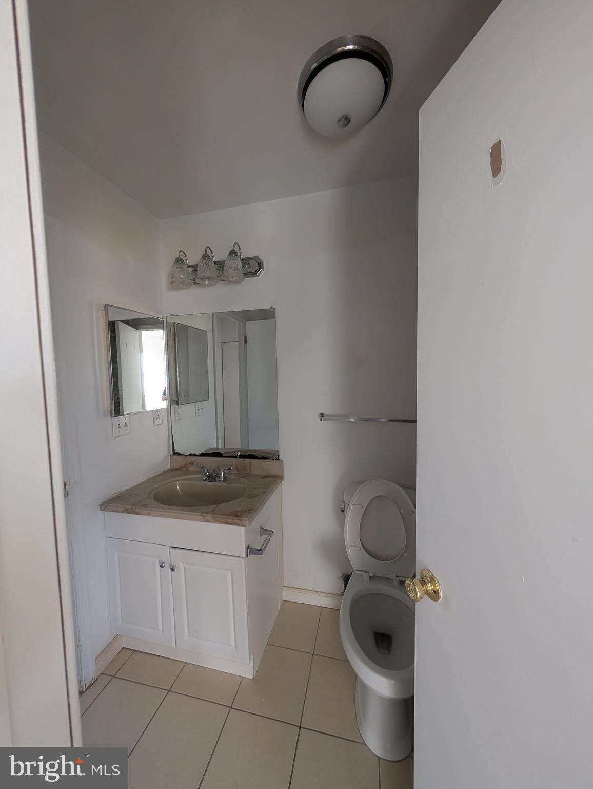 312 Cold Spring Place Dover, DE 19904 - Photo 25 of 31 a bathroom with a granite countertop sink and a mirror