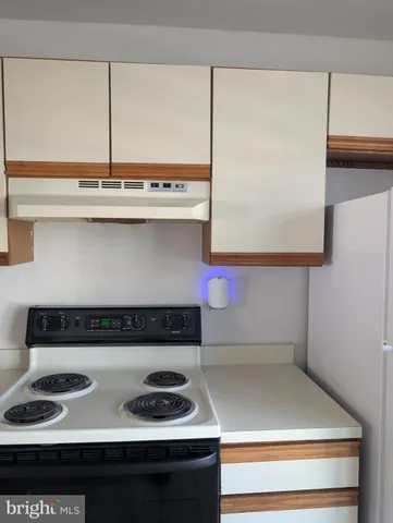 a kitchen with a stove and a microwave