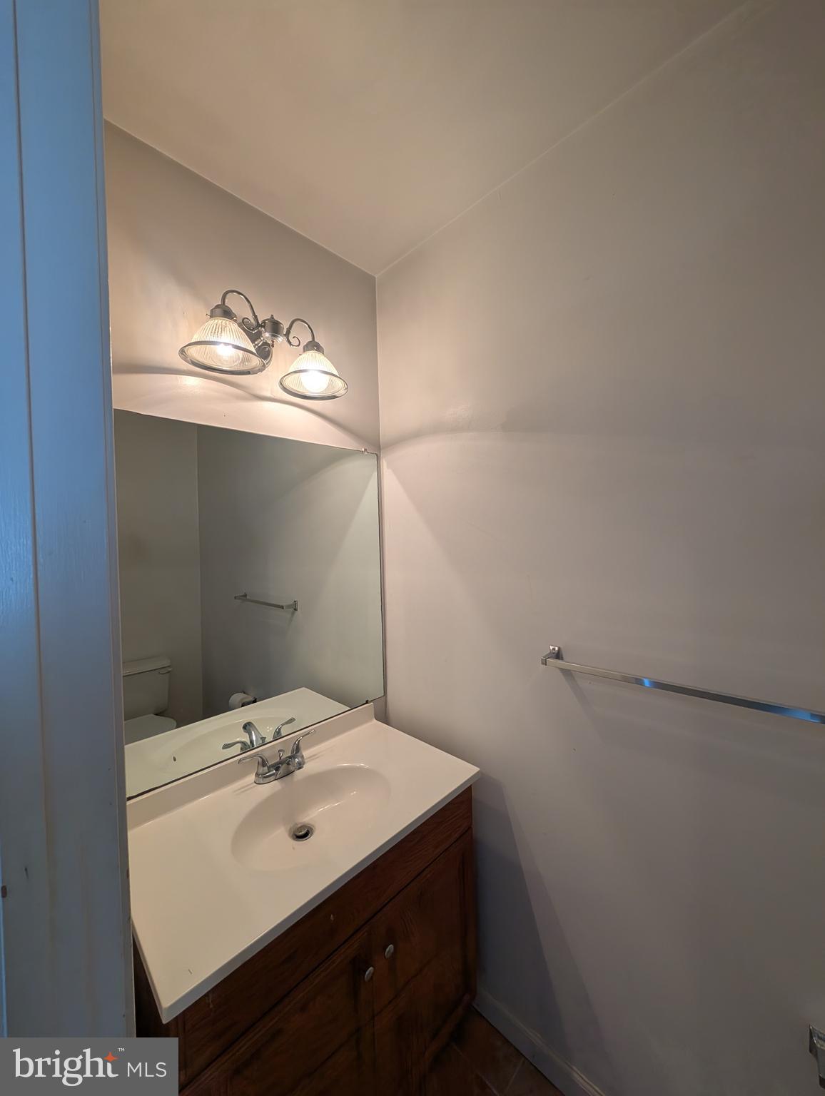 312 Cold Spring Place Dover, DE 19904 - Photo 8 of 31 a bathroom with a sink and a mirror