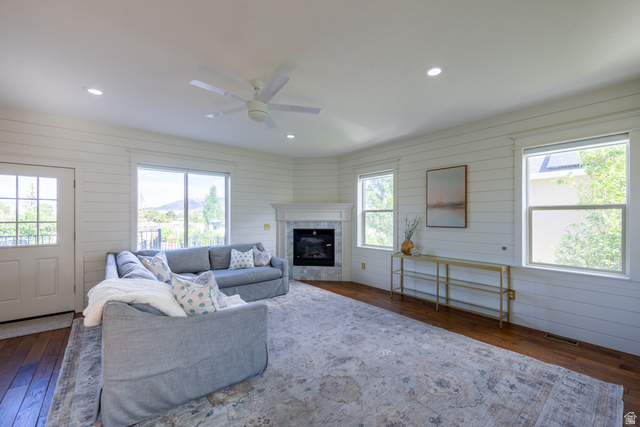 868 Braddock Lane Alpine, UT 84004 - Photo 25 of 64 Spacious room featuring wood-finish flooring, white shiplap walls, multiple windows, recessed lighting, and a white ceiling fan