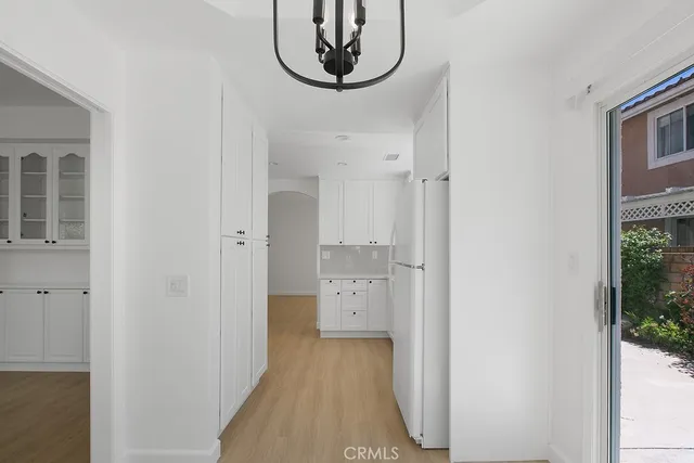 a view of an entryway with chandelier