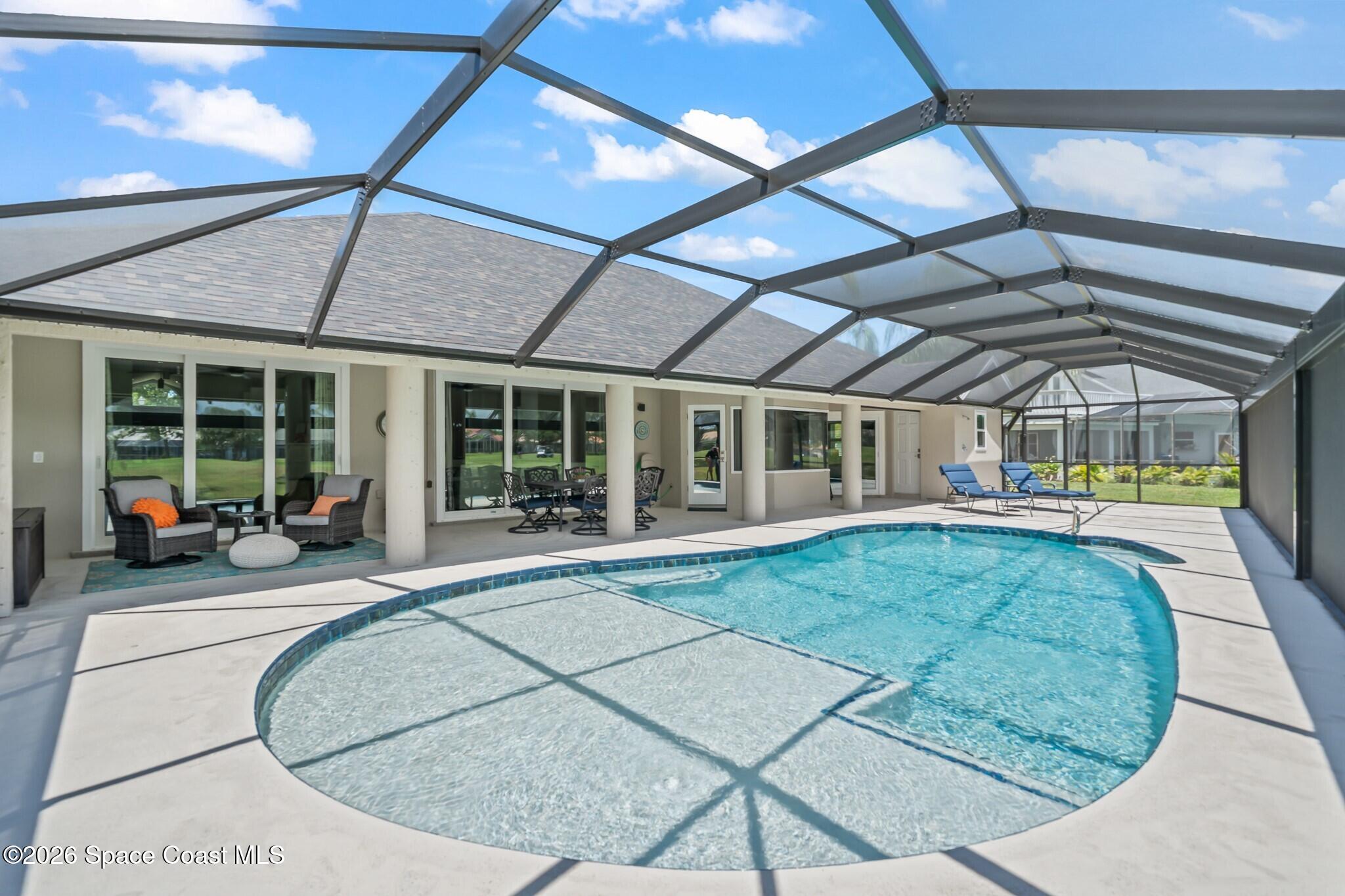 697 Spring Lake Drive Melbourne, FL 32940 - Photo 30 of 45 a view of a house with sitting area