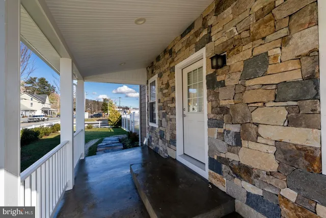 a view of a porch and garden