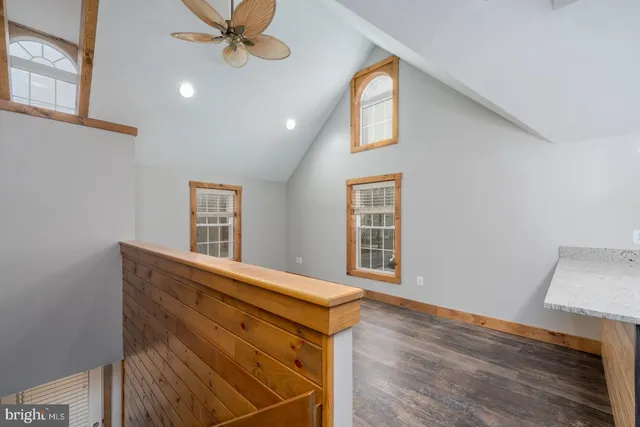 a view of an entryway with wooden floor