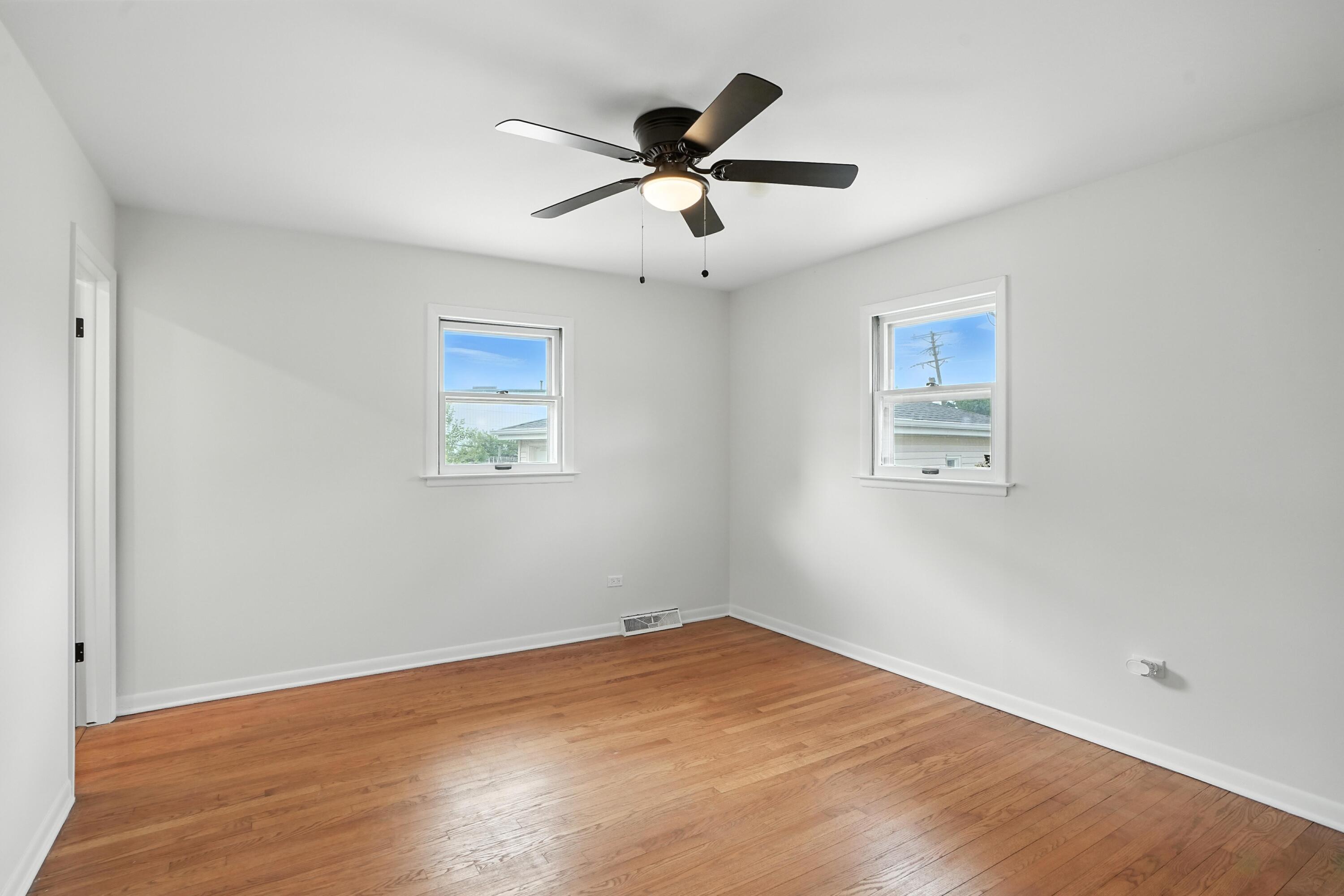 3312 East 170th Street Lansing, IL 60438 - Photo 19 of 38 a view of empty room with wooden floor
