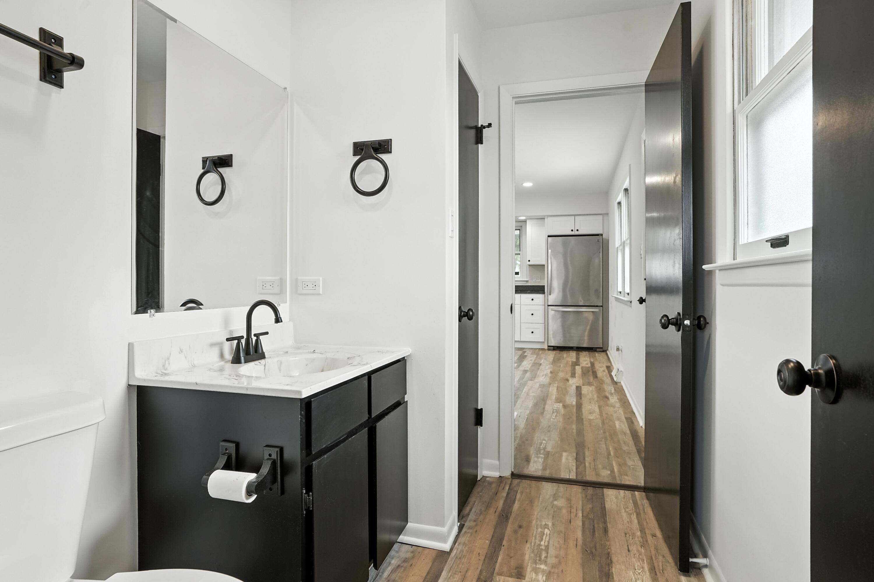 3312 East 170th Street Lansing, IL 60438 - Photo 20 of 38 a bathroom with a sink and mirror
