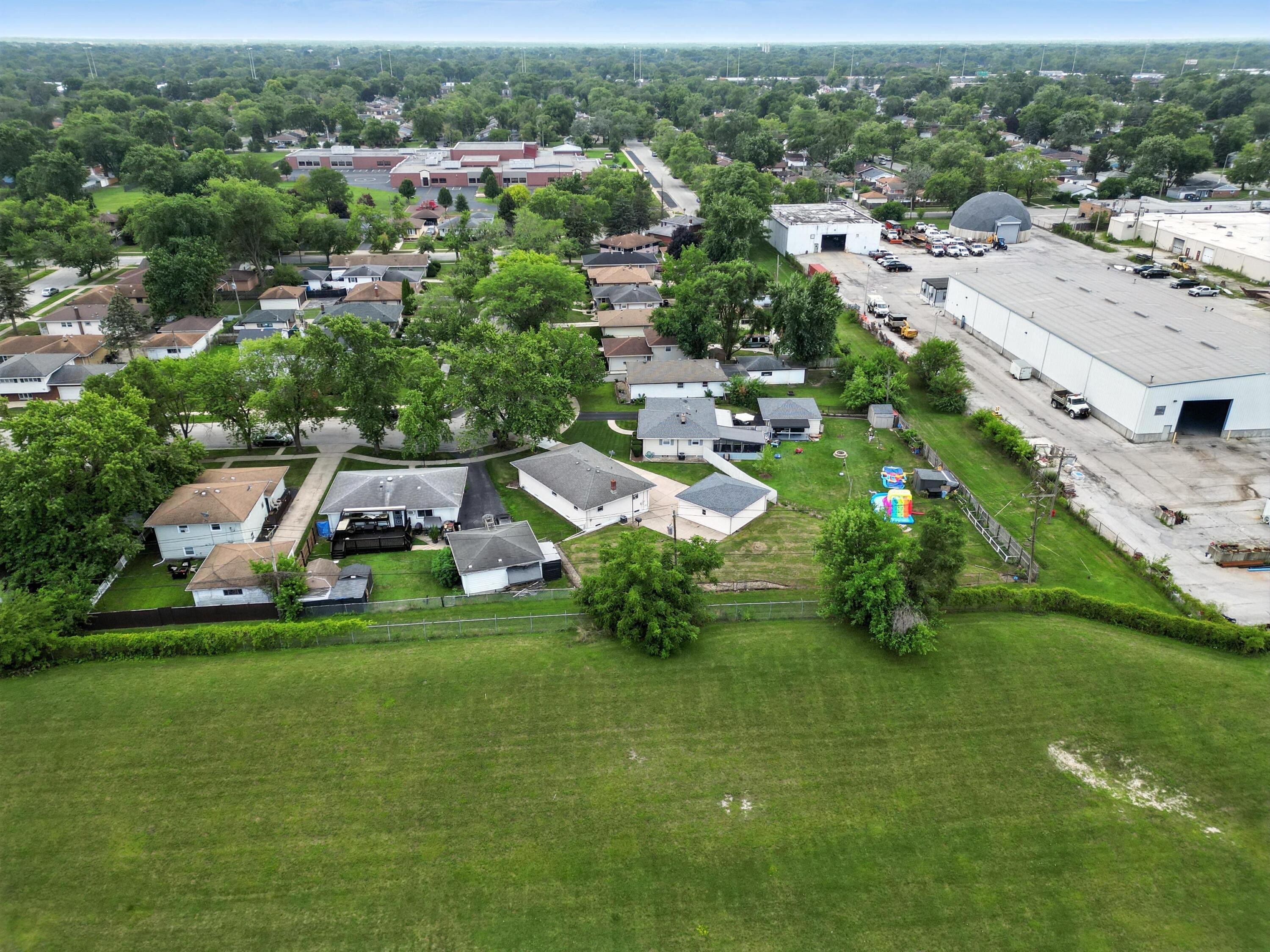 3312 East 170th Street Lansing, IL 60438 - Photo 36 of 38 an aerial view of residential houses with outdoor space and trees