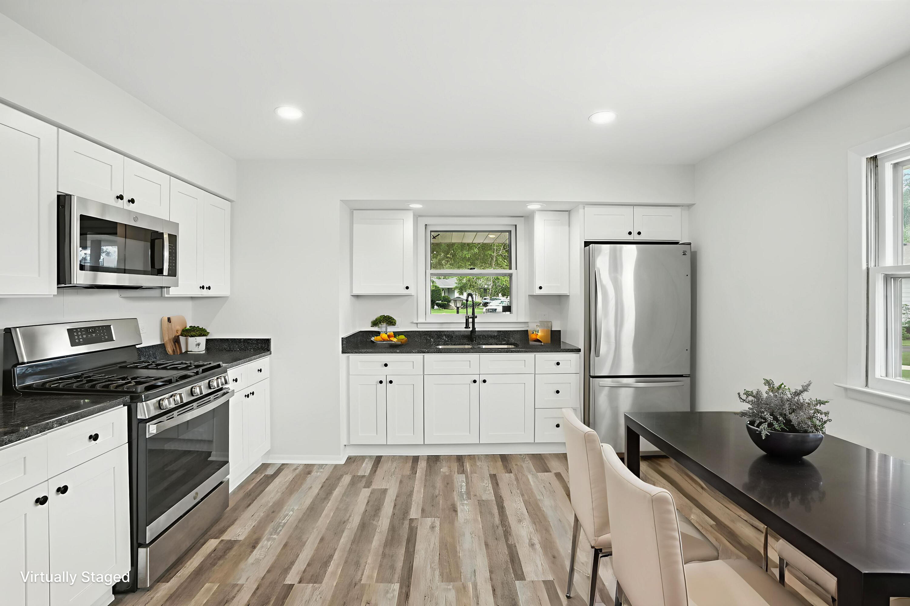 3312 East 170th Street Lansing, IL 60438 - Photo 8 of 38 a kitchen with granite countertop a refrigerator stove and sink