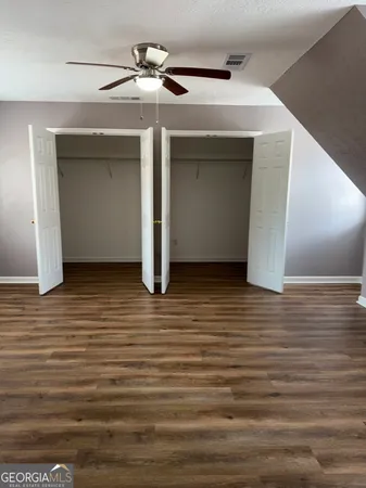 a view of a livingroom with wooden floor