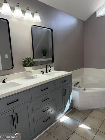 a white cabinet with a potted plant